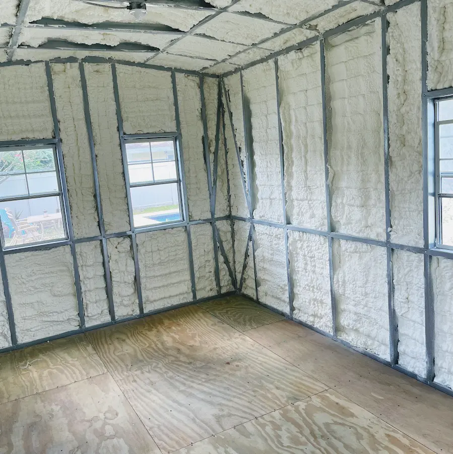 Closed-cell spray foam insulation applied to wall cavities in a residential project in Eastham
